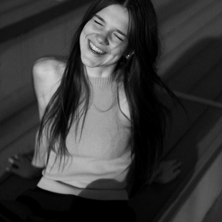 Ava Chen, Lead Design Curator at FreshStreamTrace, reviewing corporate floral arrangements